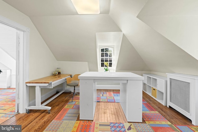 office featuring wood finished floors and vaulted ceiling