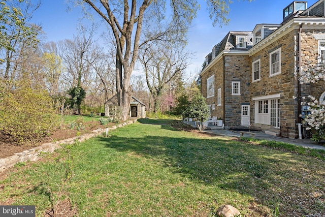 view of yard with entry steps