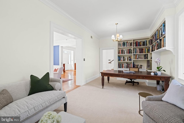 carpeted office with an inviting chandelier, baseboards, and ornamental molding