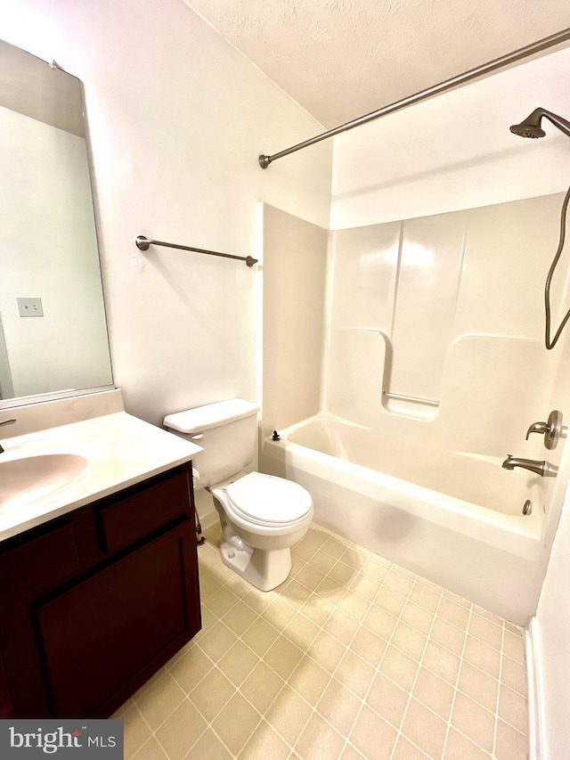 full bathroom with a textured ceiling, vanity, toilet, washtub / shower combination, and tile patterned floors