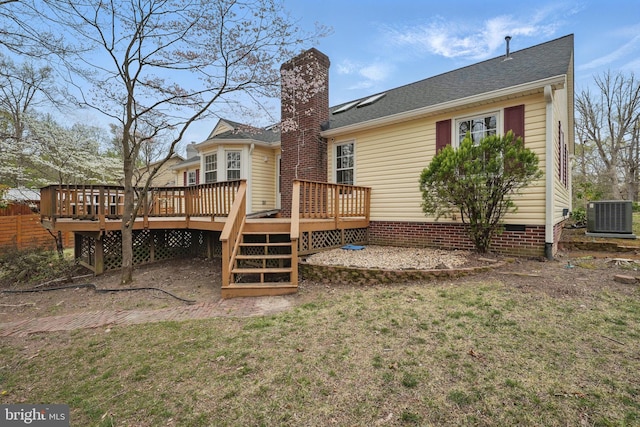 back of house with a yard, crawl space, a chimney, cooling unit, and a wooden deck