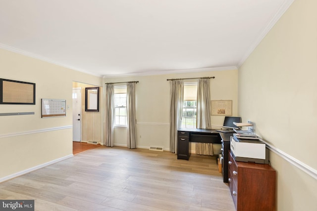 office featuring crown molding, light wood finished floors, and baseboards
