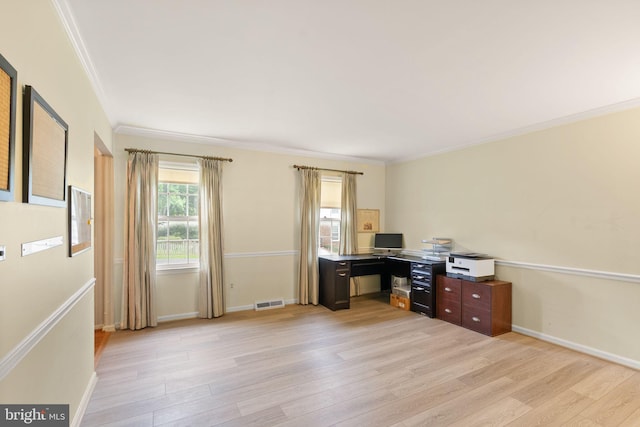 office space with crown molding, light wood-type flooring, and baseboards