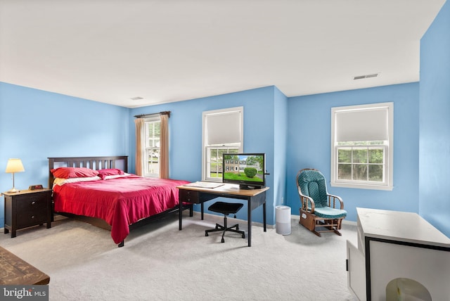 bedroom featuring carpet and baseboards