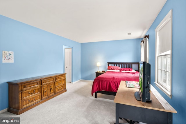 bedroom with carpet and baseboards