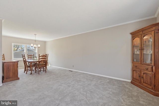 dining area featuring light carpet, a notable chandelier, baseboards, and crown molding