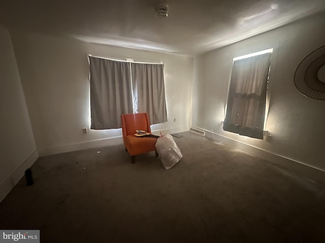 interior space with baseboards and carpet flooring