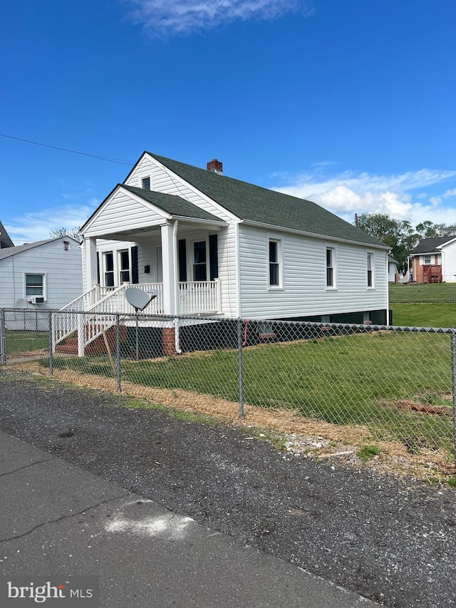 manufactured / mobile home with covered porch, a chimney, and a shingled roof
