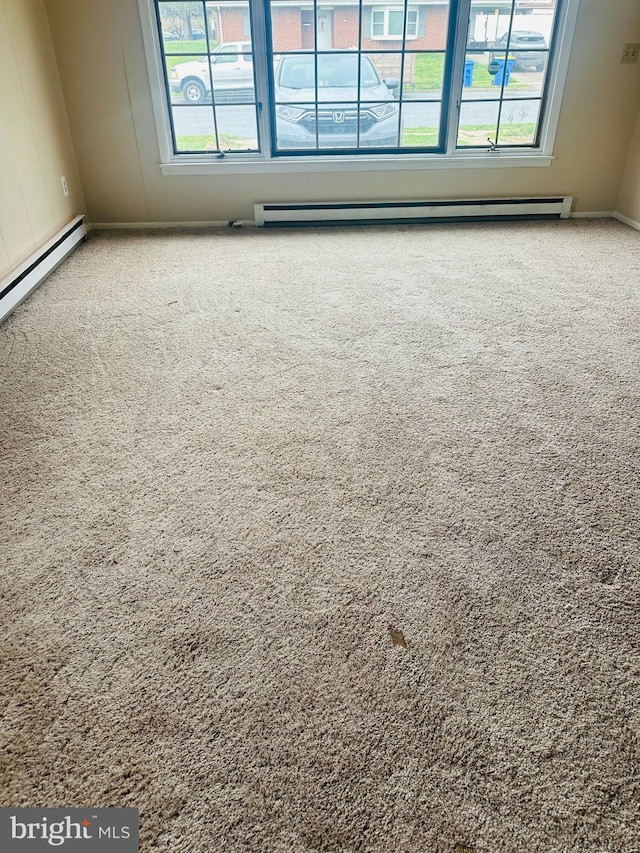 5001 Franklin St, Harrisburg, PA 17111 - unfurnished room with a baseboard heating unit, baseboards, and carpet flooring