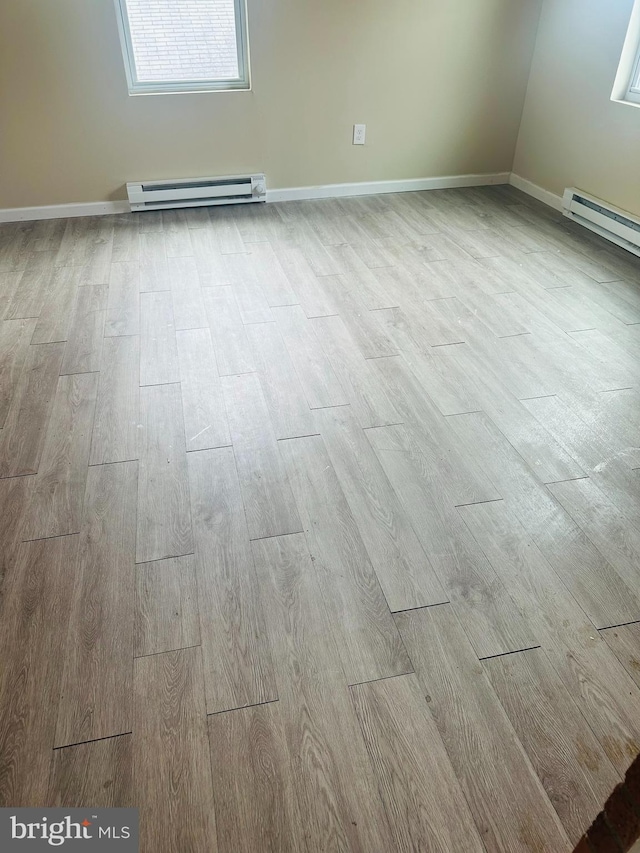 5001 Franklin St, Harrisburg, PA 17111 - room details with baseboard heating, wood finished floors, and baseboards