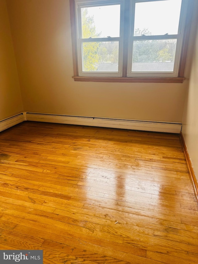 5001 Franklin St, Harrisburg, PA 17111 - spare room with hardwood / wood-style flooring and baseboard heating