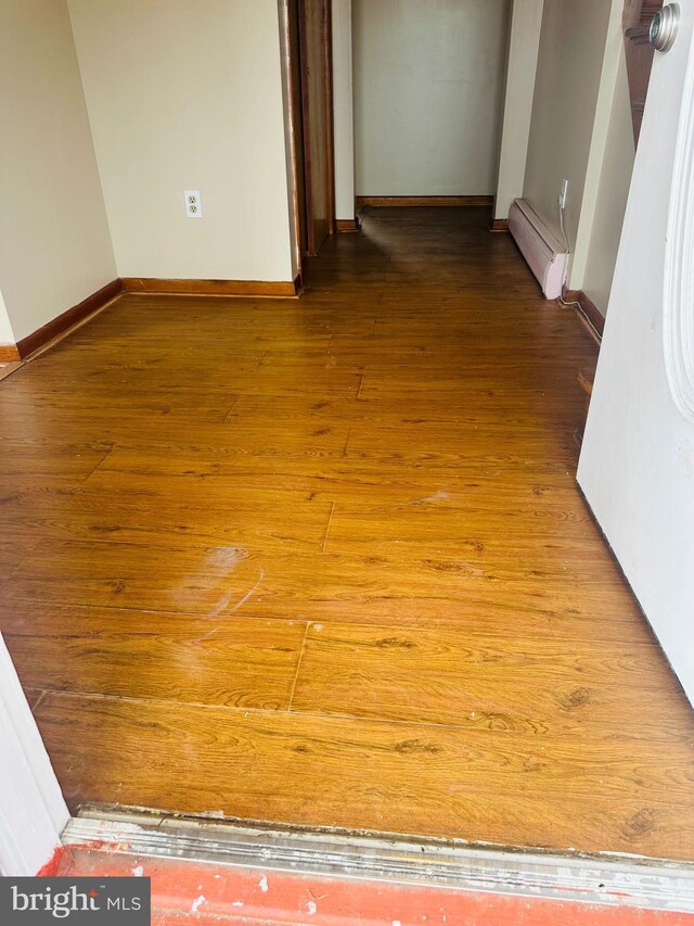 5001 Franklin St, Harrisburg, PA 17111 - corridor with baseboard heating, baseboards, and hardwood / wood-style flooring