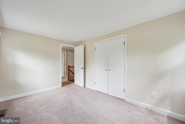 12430 Shadow Ln, Bowie, MD 20715 - unfurnished bedroom with baseboards, carpet flooring, and a closet