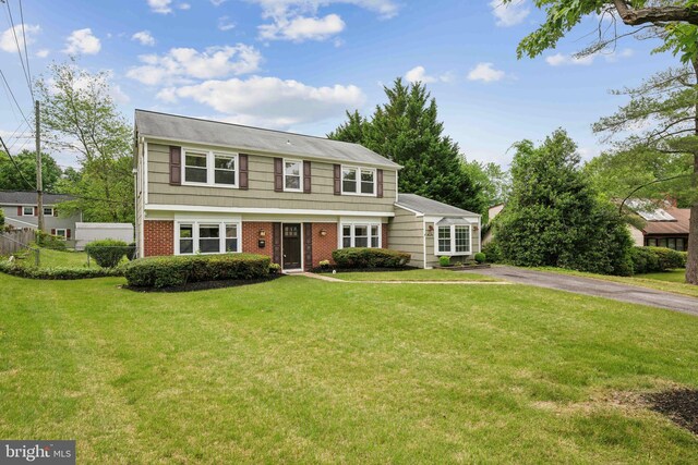 12430 Shadow Ln, Bowie, MD 20715 - colonial-style house with brick siding and asphalt driveway