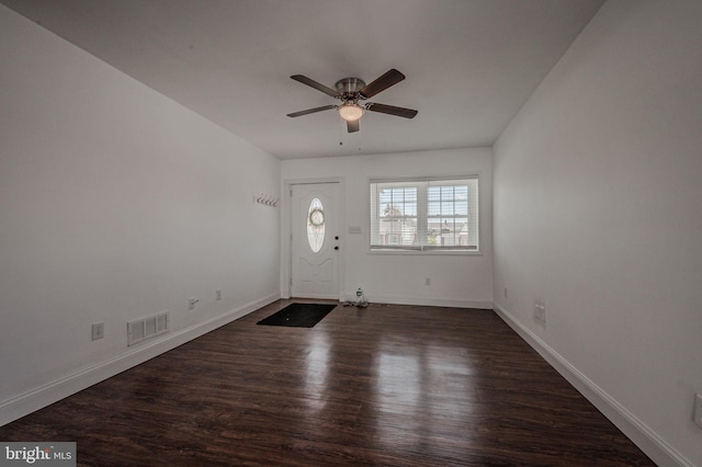 entryway featuring ceiling fan, baseboards, visible vents, and dark wood-style flooring