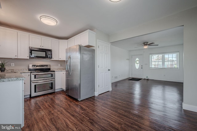 kitchen featuring dark wood-style flooring, ceiling fan, appliances with stainless steel finishes, and white cabinets