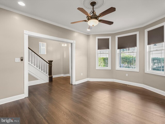 13 N Allegany St, Cumberland, MD 21502 - empty room with a ceiling fan, stairs, wood finished floors, ornamental molding, and baseboards