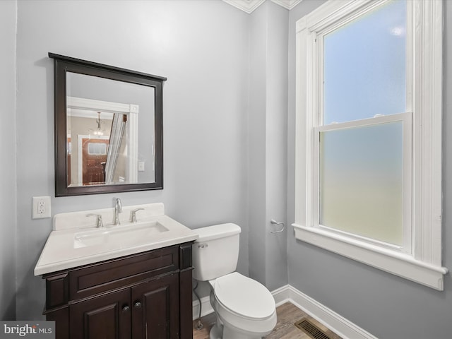 13 N Allegany St, Cumberland, MD 21502 - half bath featuring toilet, wood finished floors, baseboards, vanity, and ornamental molding