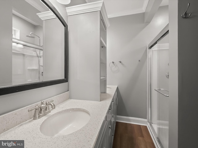 13 N Allegany St, Cumberland, MD 21502 - bathroom with a shower stall, double vanity, wood finished floors, crown molding, and baseboards