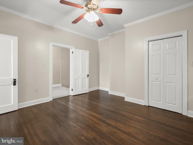 13 N Allegany St, Cumberland, MD 21502 - unfurnished bedroom with crown molding, dark wood-type flooring, baseboards, a ceiling fan, and a closet