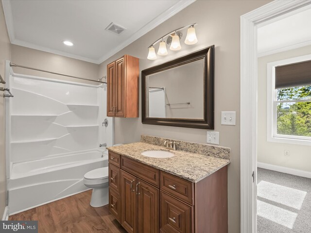 13 N Allegany St, Cumberland, MD 21502 - bathroom featuring crown molding, vanity, toilet, wood finished floors, and shower / tub combination