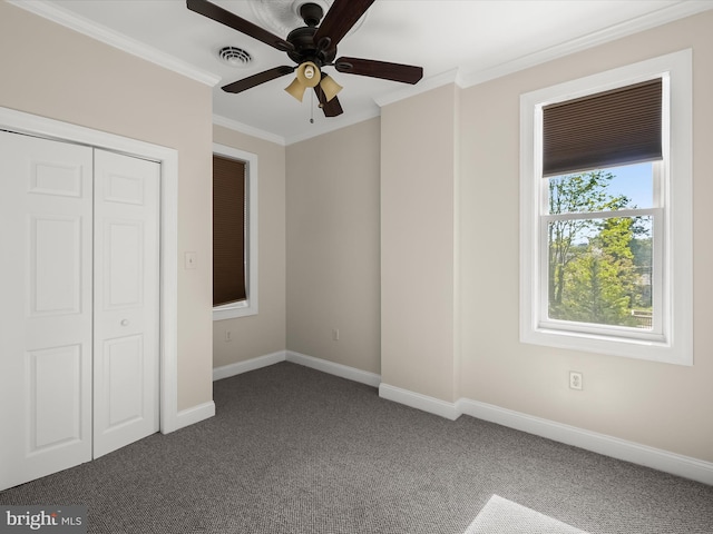 13 N Allegany St, Cumberland, MD 21502 - unfurnished bedroom with dark carpet, crown molding, baseboards, a closet, and a ceiling fan