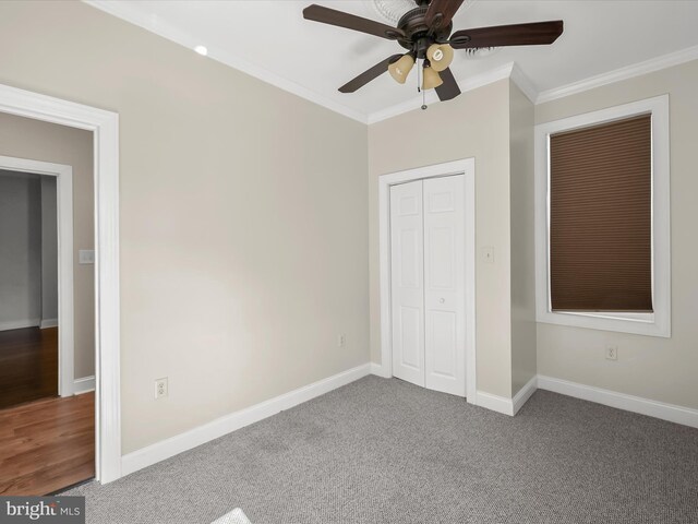 13 N Allegany St, Cumberland, MD 21502 - unfurnished bedroom featuring crown molding, baseboards, carpet, a ceiling fan, and a closet