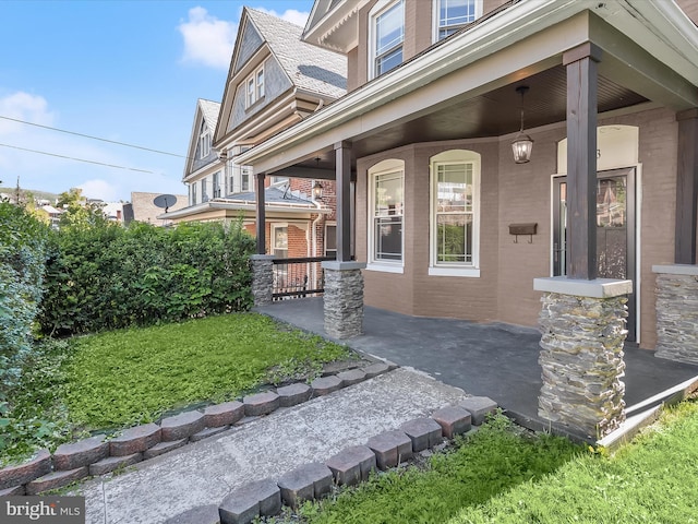 13 N Allegany St, Cumberland, MD 21502 - property entrance with a porch and brick siding