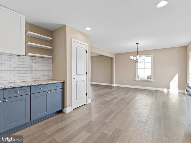 200 School Rd, Bethel, DE 19931 - kitchen with tasteful backsplash, light wood finished floors, a notable chandelier, and open shelves