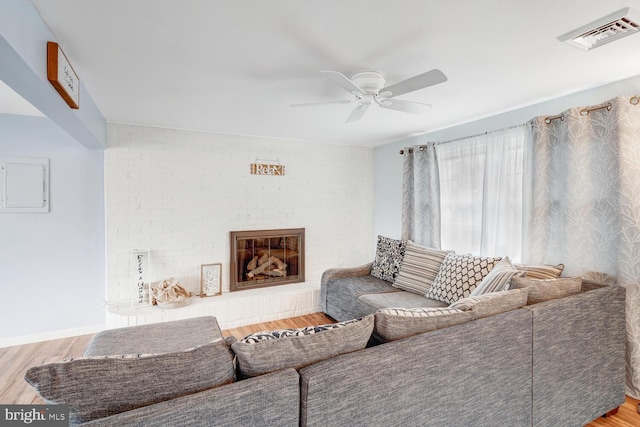 33 W Delaware Dr, Little Egg Harbor Twp, NJ 08087 - living room with electric panel, baseboards, visible vents, wood finished floors, and ceiling fan