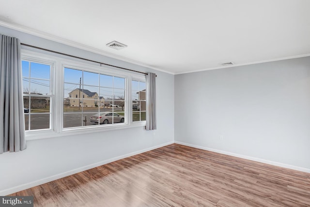 33 W Delaware Dr, Little Egg Harbor Twp, NJ 08087 - unfurnished room with baseboards, wood finished floors, visible vents, and crown molding