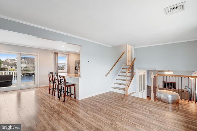 33 W Delaware Dr, Little Egg Harbor Twp, NJ 08087 - living room featuring recessed lighting, wood finished floors, visible vents, ornamental molding, and baseboards
