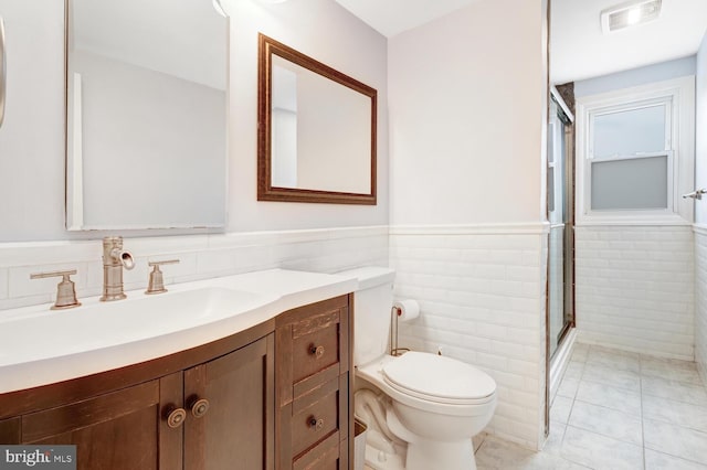 33 W Delaware Dr, Little Egg Harbor Twp, NJ 08087 - full bath with tile patterned floors, wainscoting, a shower with door, tile walls, and visible vents