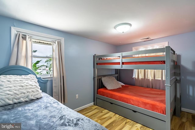 33 W Delaware Dr, Little Egg Harbor Twp, NJ 08087 - bedroom with baseboards, wood finished floors, and visible vents