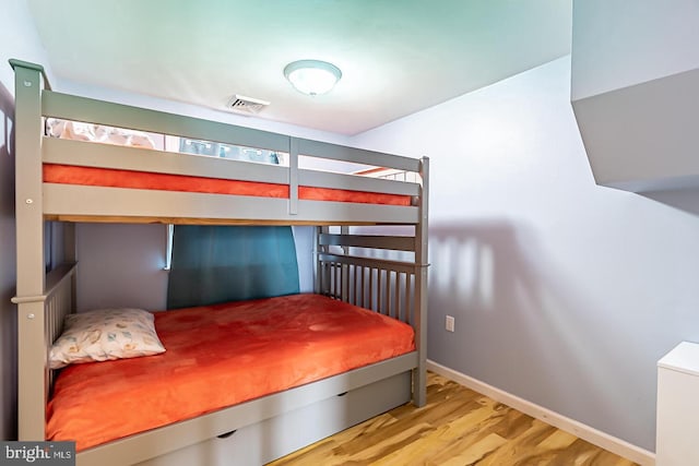 33 W Delaware Dr, Little Egg Harbor Twp, NJ 08087 - bedroom with baseboards, wood finished floors, and visible vents