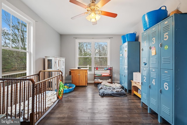 173 Puffball Rd, Hedgesville, WV 25427 - bedroom featuring a crib, wood-type flooring, and ceiling fan
