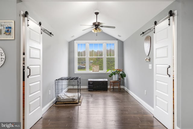 173 Puffball Rd, Hedgesville, WV 25427 - foyer featuring ceiling fan, a barn door, wood finished floors, and lofted ceiling