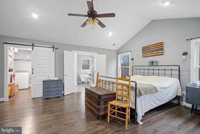 173 Puffball Rd, Hedgesville, WV 25427 - bedroom with vaulted ceiling, recessed lighting, a barn door, washer and dryer, and wood finished floors