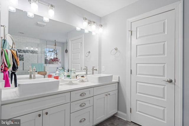 173 Puffball Rd, Hedgesville, WV 25427 - full bathroom featuring a shower stall, double vanity, a sink, and baseboards