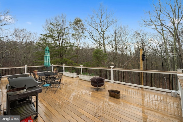 173 Puffball Rd, Hedgesville, WV 25427 - wooden deck with outdoor dining area and an outdoor fire pit