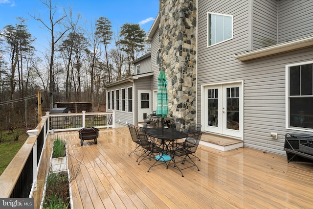 173 Puffball Rd, Hedgesville, WV 25427 - wooden terrace with french doors, a fire pit, and outdoor dining area