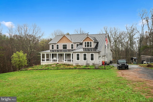 173 Puffball Rd, Hedgesville, WV 25427 - view of front facade with a porch, metal roof, a standing seam roof, and a front lawn