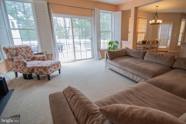 12253 Tulane Falls Dr, Bristow, VA 20136 - living area featuring carpet and a notable chandelier