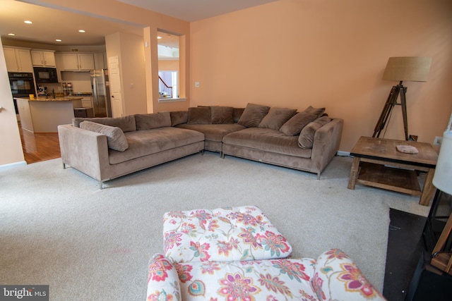 12253 Tulane Falls Dr, Bristow, VA 20136 - living room featuring light carpet and recessed lighting