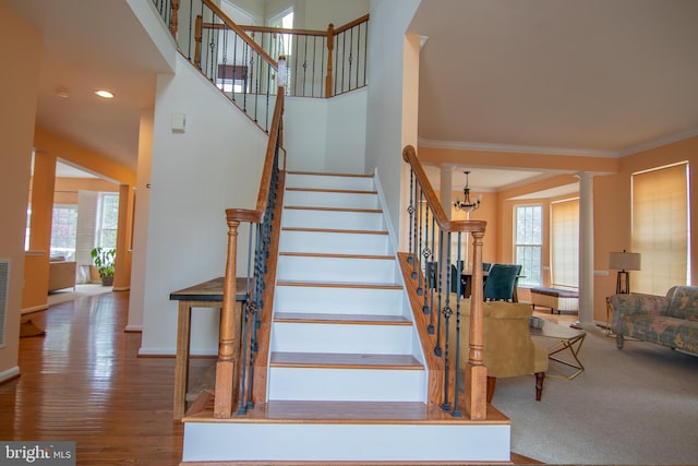 12253 Tulane Falls Dr, Bristow, VA 20136 - stairway featuring visible vents, wood finished floors, baseboards, and crown molding