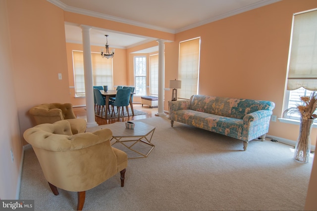 12253 Tulane Falls Dr, Bristow, VA 20136 - carpeted living area featuring baseboards, ornamental molding, a chandelier, and ornate columns