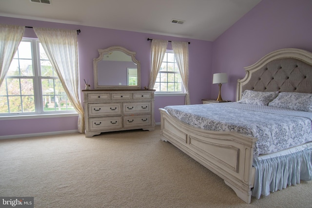 12253 Tulane Falls Dr, Bristow, VA 20136 - bedroom with light colored carpet, baseboards, vaulted ceiling, and visible vents