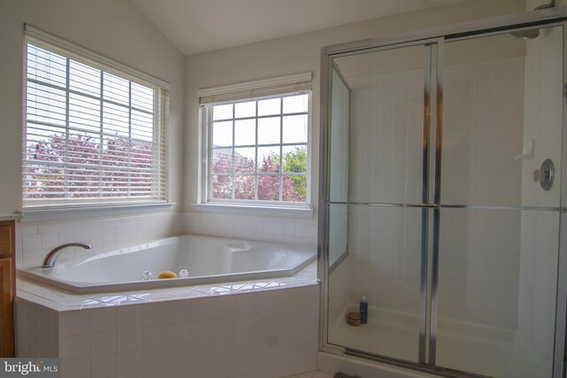 12253 Tulane Falls Dr, Bristow, VA 20136 - full bath with lofted ceiling, a garden tub, and a shower stall
