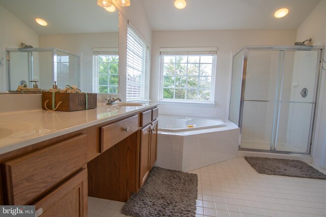 12253 Tulane Falls Dr, Bristow, VA 20136 - full bath featuring a shower stall, a garden tub, a sink, double vanity, and tile patterned flooring