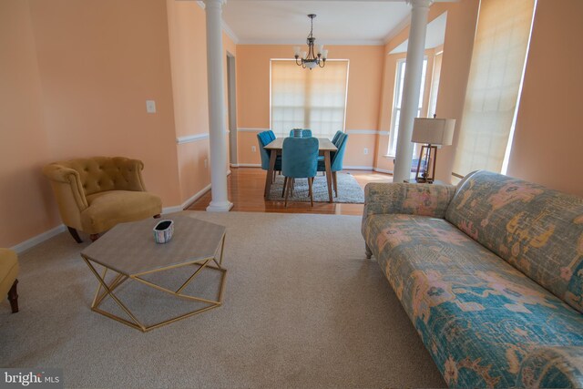 12253 Tulane Falls Dr, Bristow, VA 20136 - living area with baseboards, ornamental molding, a chandelier, and ornate columns